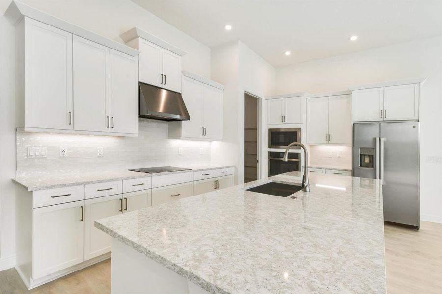 Furnished interior view inside a new home in PGA Village Verano, Port St. Lucie (Image 6).