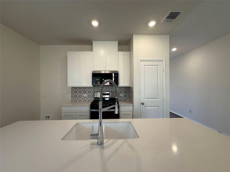 Furnished interior view inside a new home in River Bluff, Leander (Image 5).
