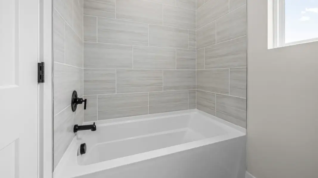 Bathtub and shower in connecting bathroom