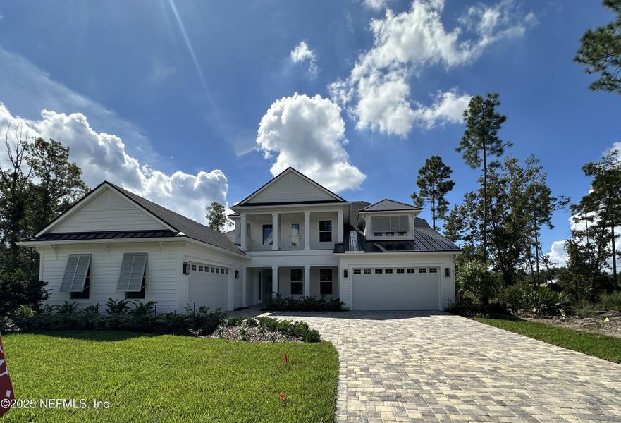 Front exterior of a new home in SilverLeaf, St. Augustine, FL, highlighting curb appeal (Image 2).