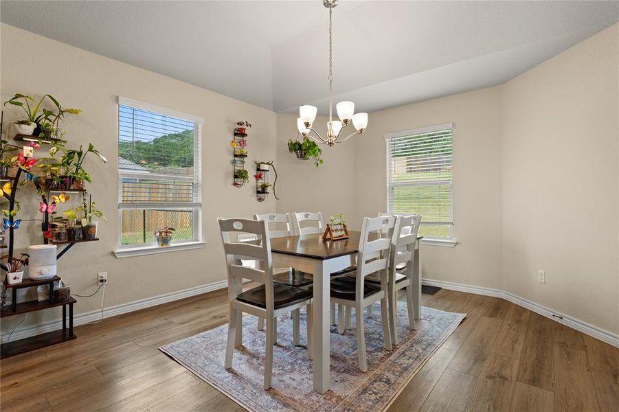 Dining room featuring a chandelier and light wood-style floors