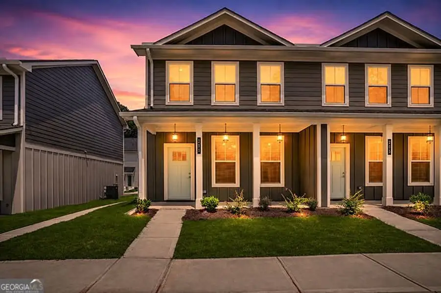 Front exterior of a new home in The Cottages at East Lanier, Fayetteville, GA, highlighting curb appeal (Image 2). Front exterior of a new home in The Cottages at East Lanier, Fayetteville, GA, highlighting curb appeal (Image 2).