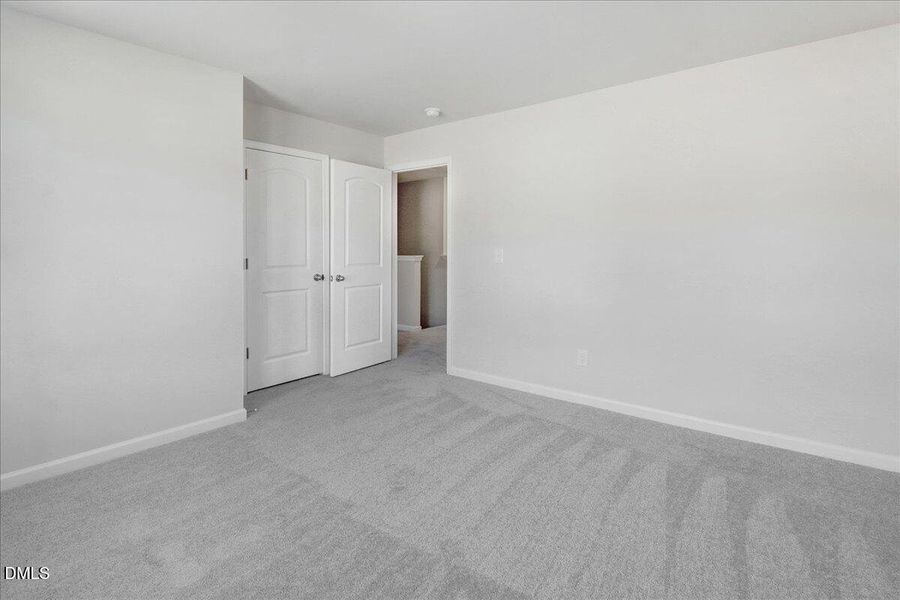 17-Bedroom with closet and carpet floori