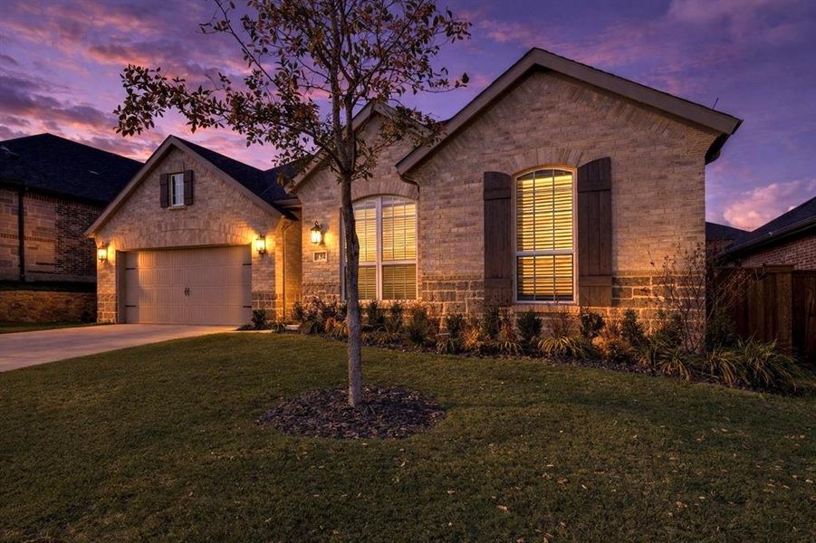 Front exterior of a new home in Reunion, Rhome, TX, highlighting curb appeal (Image 23).