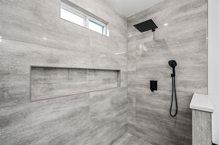 Bathroom featuring tiled shower