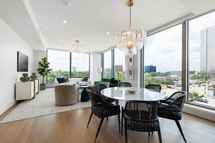 Seamless living in an open-concept layout, framed by breathtaking views of the city skyline. Photos are of a similar unit with the same floor plan