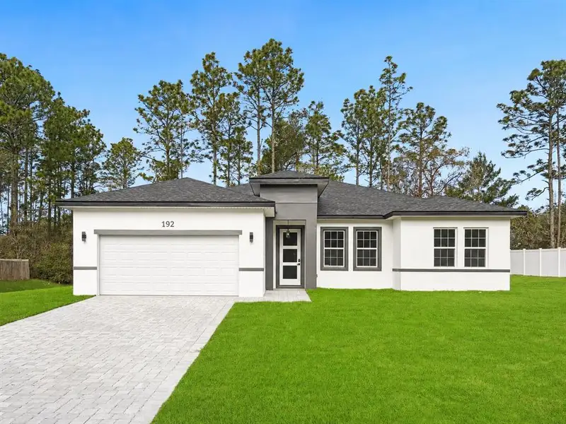 Front exterior of a new home in , Ocala, FL, highlighting curb appeal (Image 1). Front exterior of a new home in , Ocala, FL, highlighting curb appeal (Image 1).