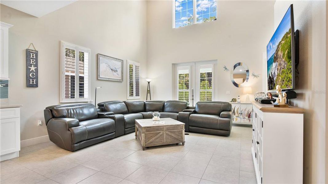 LIVING ROOM WITH PLANTATION SHUTTERS THROUGHOUT