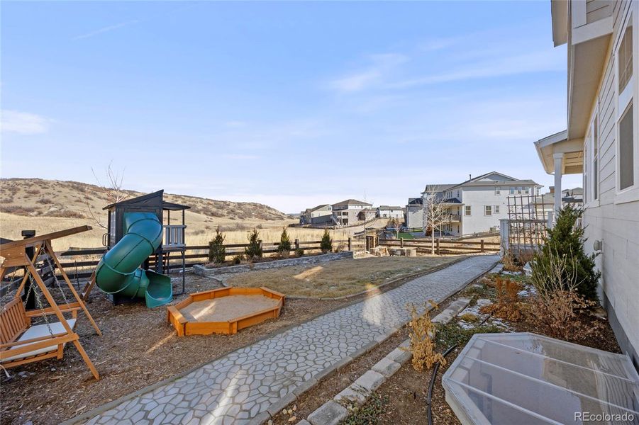 Grand backyard w room to play and abcking to open space and views