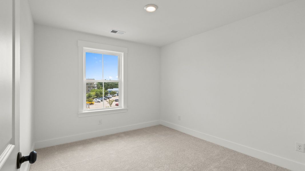 A cheerful Brookgreen secondary bedroom at Seabreeze—perfect for comfort, play, and rest.