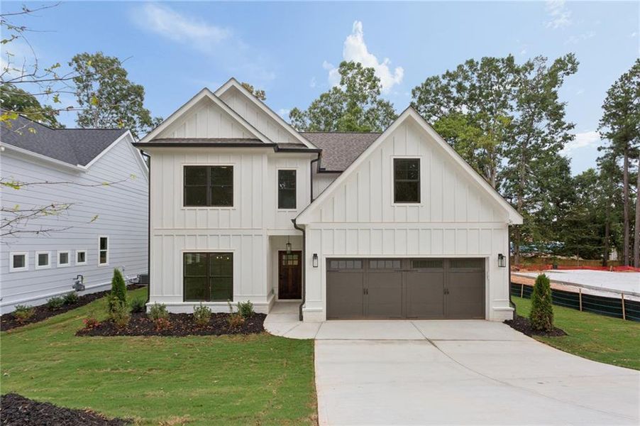 Front exterior of a new home in , Smyrna, GA, highlighting curb appeal (Image 1). Front exterior of a new home in , Smyrna, GA, highlighting curb appeal (Image 1).