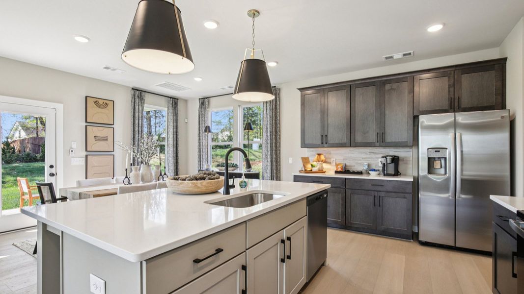 Large kitchen with island and adjacent dining area