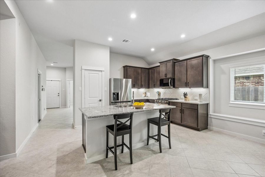Kitchen with stainless steel appliances and grand gas range just awaiting preparation of its next meal!! Kitchen with stainless steel appliances and grand gas range just awaiting preparation of its next meal!!