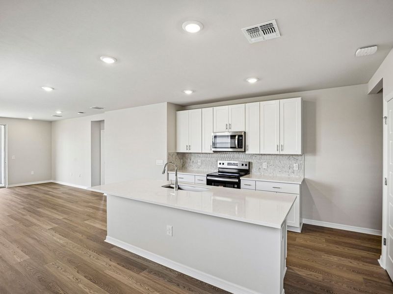 Furnished interior view inside a new home in Crescent Lakes - Premier Series, Punta Gorda (Image 5).