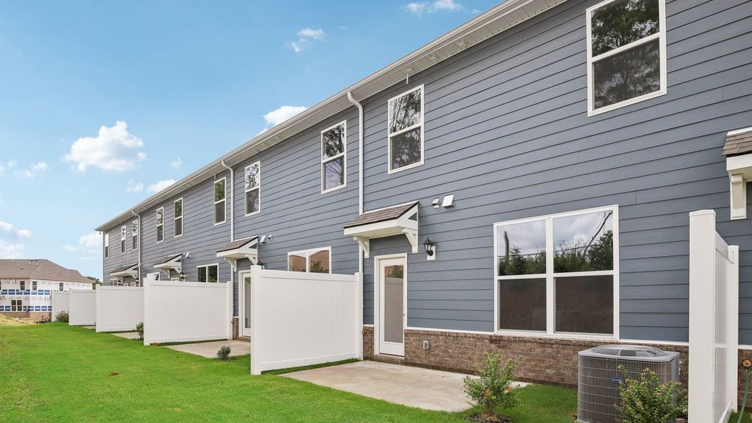 Exterior details and patio area of a home in River Landing Townhomes, Murfreesboro (Image 23). Exterior details and patio area of a home in River Landing Townhomes, Murfreesboro (Image 23).