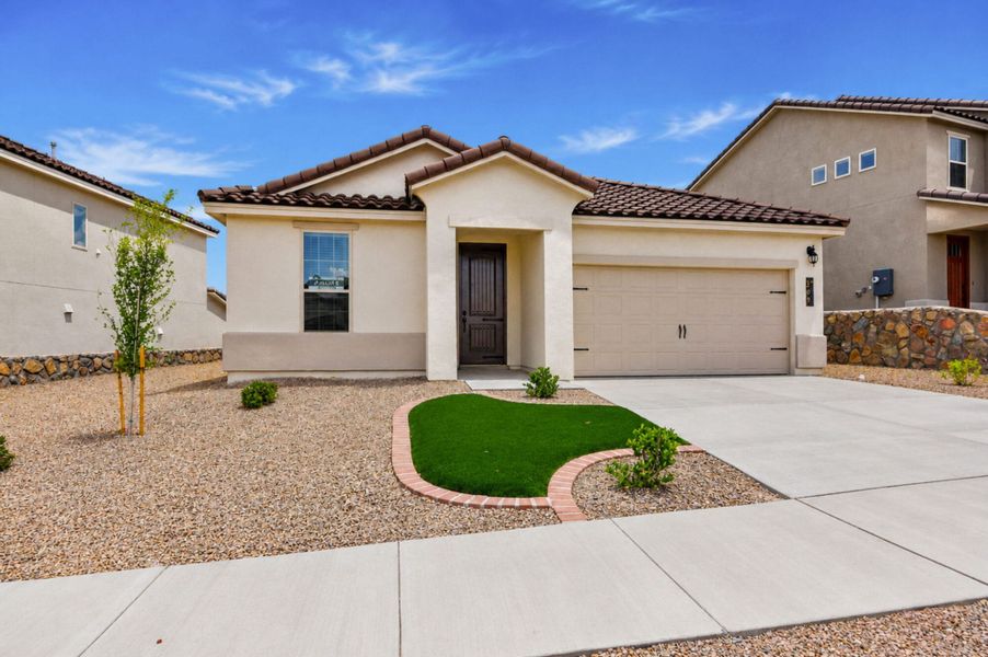 Front exterior of a new home in Emerald Estates, Horizon City, TX, highlighting curb appeal (Image 2). Front exterior of a new home in Emerald Estates, Horizon City, TX, highlighting curb appeal (Image 2).
