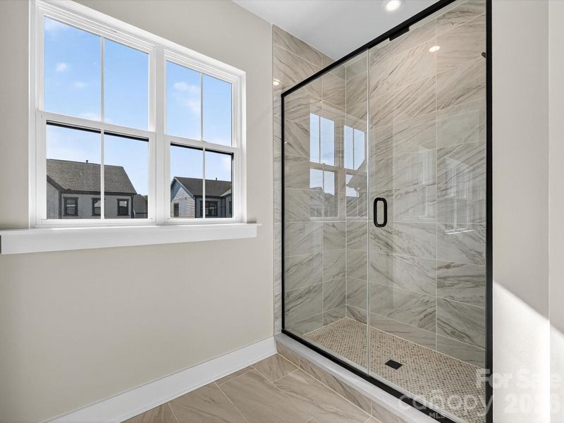 Primary Bathroom with Walk-In Tiled Shower Walls and Floor Pan
