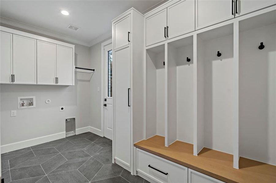 Laundry room with sink, lockers,and even room for another big refrigerator on other side of room next to sink