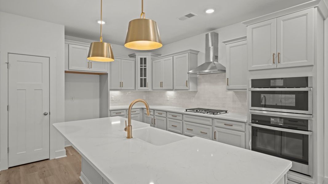 Accomplished layout with a stunning 8-foot island, pendant lighting, and superior craftsmanship