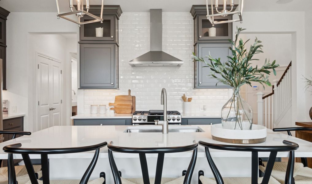 Kitchen with full-height tile backsplash