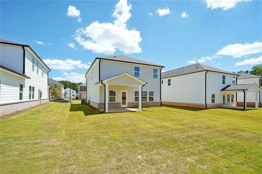 Front exterior of a new home in Martin Springs - Reserve Series, Lawrenceville, GA, highlighting curb appeal (Image 19). Front exterior of a new home in Martin Springs - Reserve Series, Lawrenceville, GA, highlighting curb appeal (Image 19).