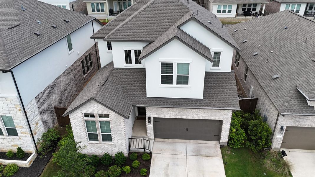 Contemporary two-story residence featuring a light brick and stucco exterior Contemporary two-story residence featuring a light brick and stucco exterior