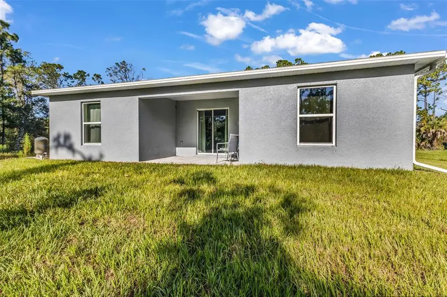 Exterior details and patio area of a home in , North Port (Image 23).