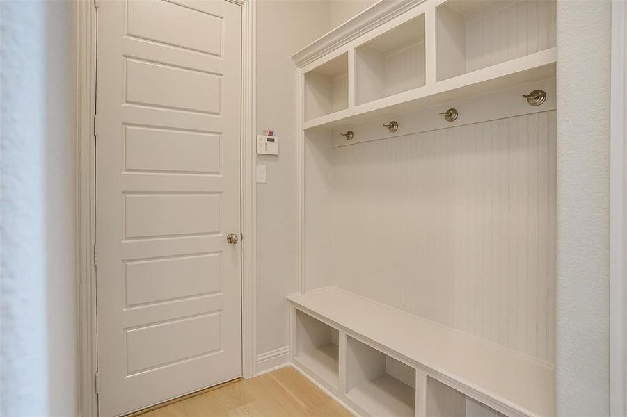 Mudroom featuring light wood-type flooring