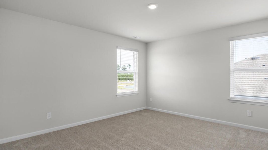 Spacious, unfurnished interior of a new home in Surfside Landing, Hubert (Image 27).