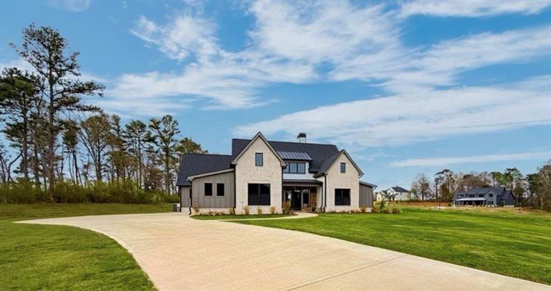 Front exterior of a new home in , Rydal, GA, highlighting curb appeal (Image 1). Front exterior of a new home in , Rydal, GA, highlighting curb appeal (Image 1).