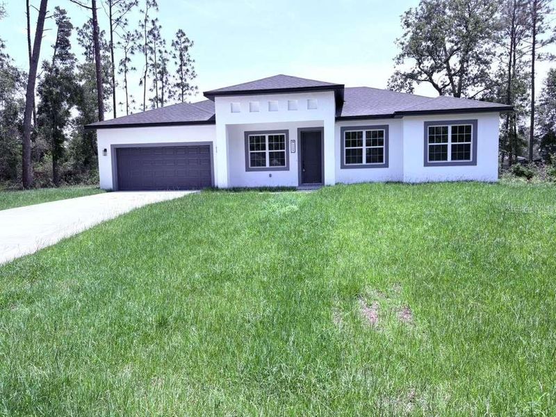 Front exterior of a new home in , Ocala, FL, highlighting curb appeal (Image 21).
