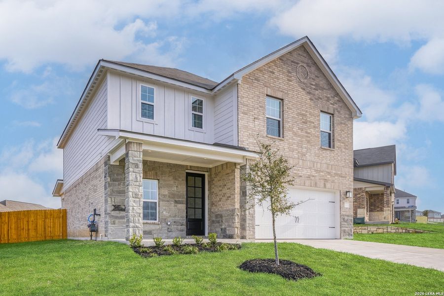 Front exterior of a new home in Hightop Ridge, Converse, TX, highlighting curb appeal (Image 2). Front exterior of a new home in Hightop Ridge, Converse, TX, highlighting curb appeal (Image 2).