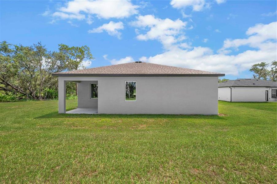 Exterior details and patio area of a home in Poinciana, Poinciana (Image 2).