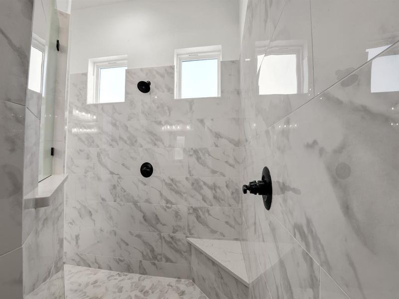 Bathroom featuring tiled shower