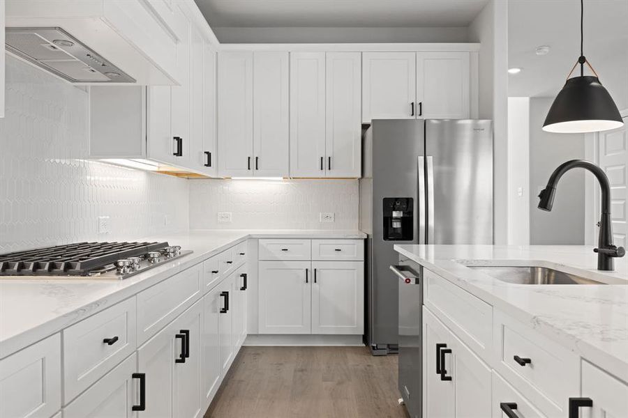 No shortage of style, storage or prep space in this wonderful kitchen!