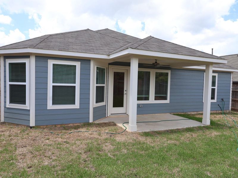 Exterior details and patio area of a home in Magnolia Ridge, Magnolia (Image 4).