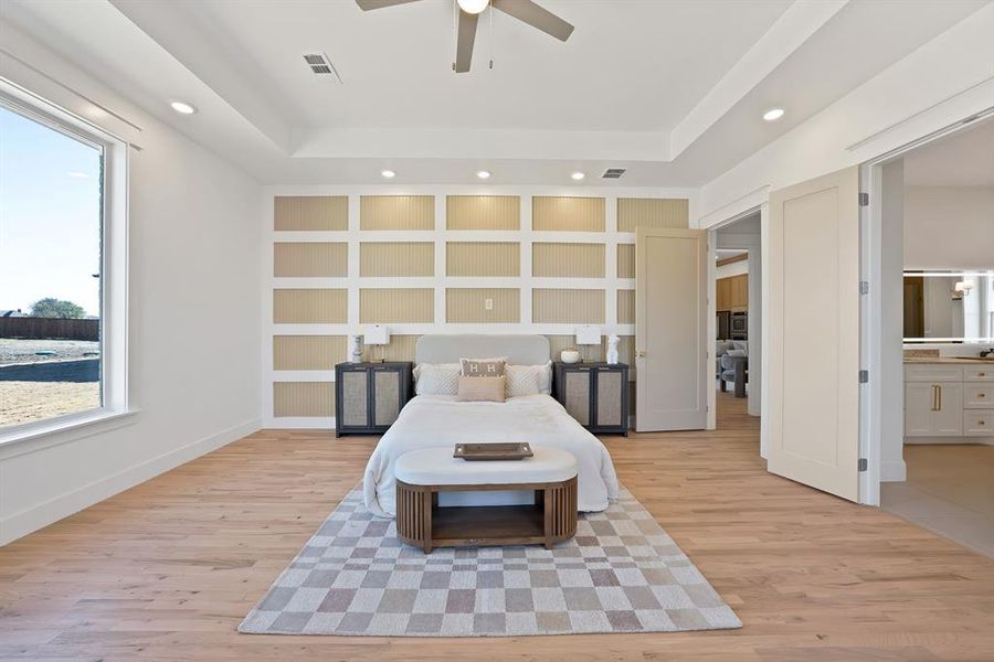 Bedroom featuring light wood-type flooring, recessed lighting, ceiling fan, and ensuite bathroom