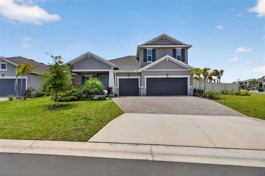 Front exterior of a new home in Seaire, Parrish, FL, highlighting curb appeal (Image 24).