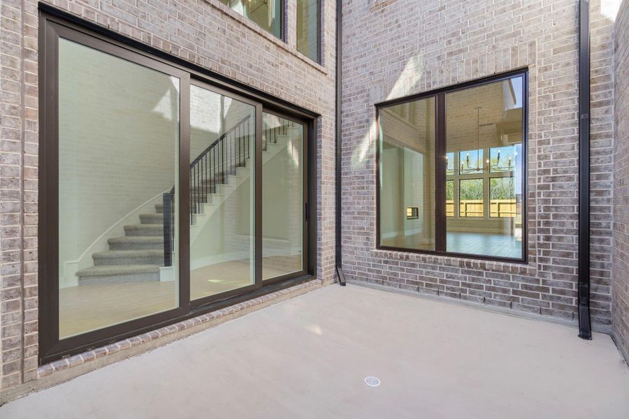 Exterior details and patio area of a home in Fulbrook on Fulshear Creek 60', Fulshear (Image 4). Exterior details and patio area of a home in Fulbrook on Fulshear Creek 60', Fulshear (Image 4).