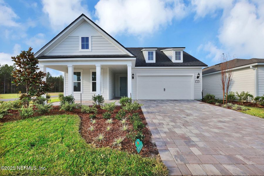 Front exterior of a new home in Del Webb Saint Johns, St. Johns, FL, highlighting curb appeal (Image 1).