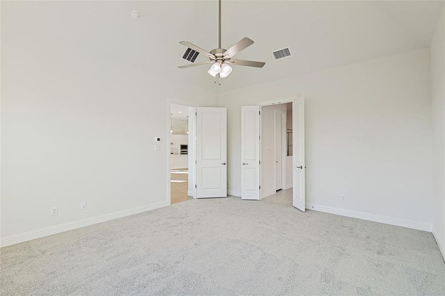 Bathroom with two vanities, a garden tub, and light tile patterned floors Bathroom with two vanities, a garden tub, and light tile patterned floors