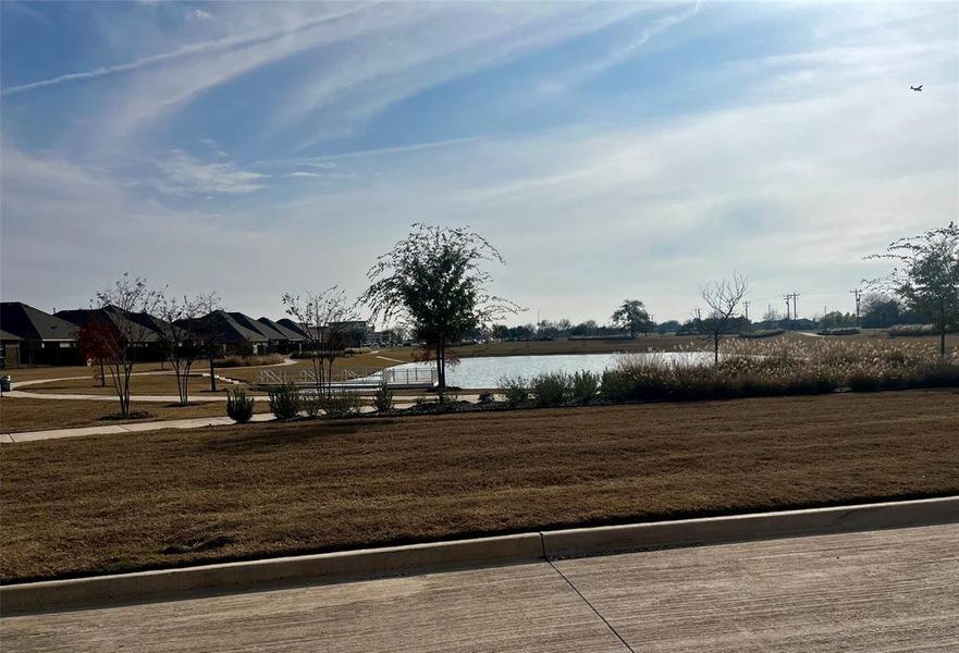 Surrounding community featuring a water view