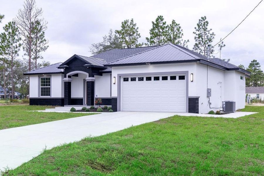 Front exterior of a new home in , Dunnellon, FL, highlighting curb appeal (Image 30). Front exterior of a new home in , Dunnellon, FL, highlighting curb appeal (Image 30).