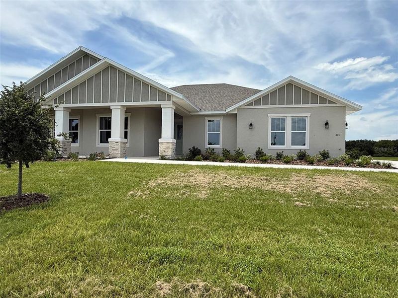 Front exterior of a new home in , Ocala, FL, highlighting curb appeal (Image 2).