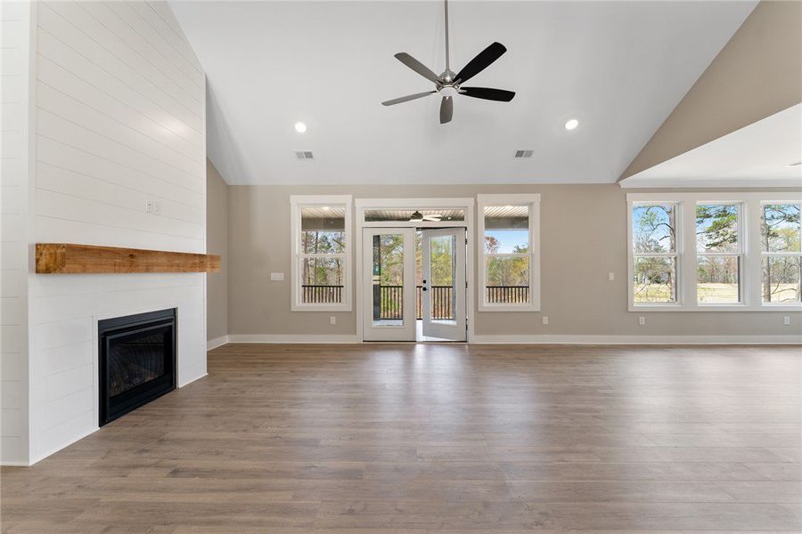 A spacious living area features a charming firepla A spacious living area features a charming firepla