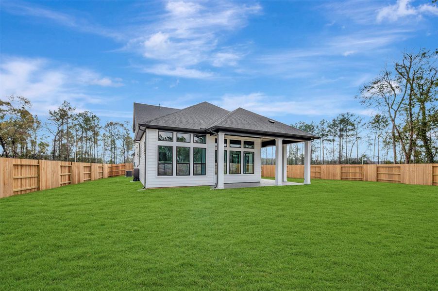 Exterior details and patio area of a home in ARTAVIA 50' Homesites, Conroe (Image 3).