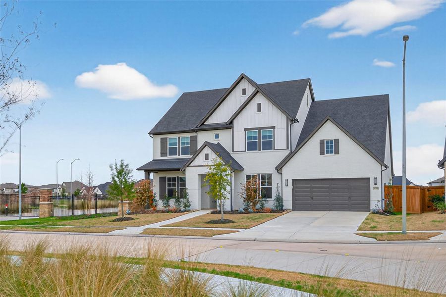 Front exterior of a new home in Dunham Pointe 65' Homesites, Cypress, TX, highlighting curb appeal (Image 26). Front exterior of a new home in Dunham Pointe 65' Homesites, Cypress, TX, highlighting curb appeal (Image 26).