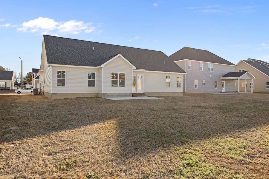 Exterior details and patio area of a home in Arbor Hills South II, Greenville (Image 24).