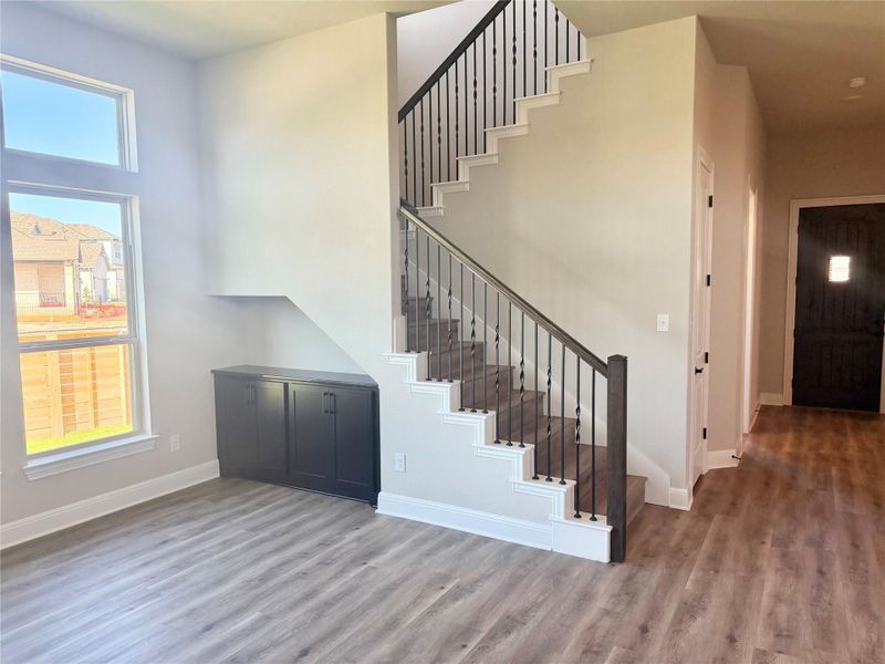 Stairway featuring wood finished floors and baseboards Stairway featuring wood finished floors and baseboards