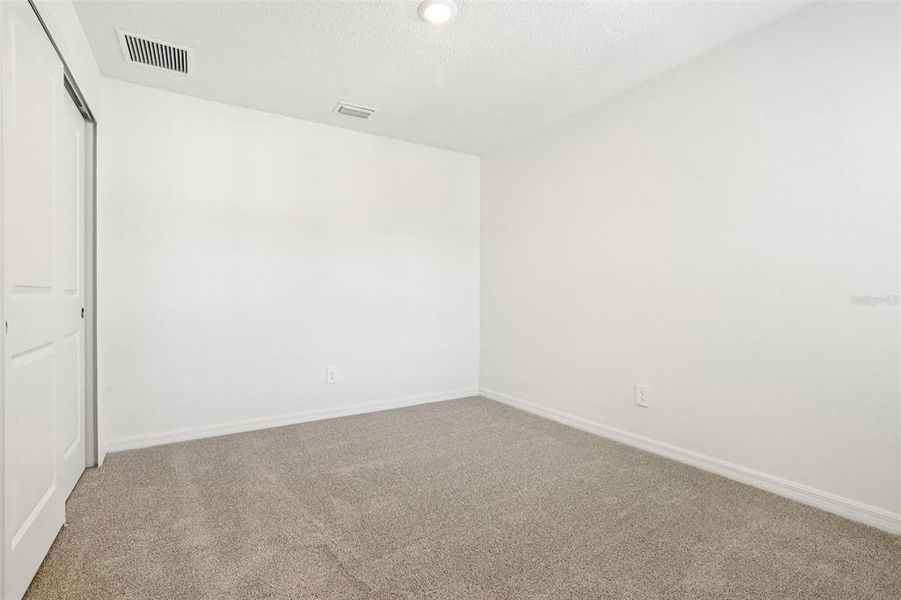 Spacious, unfurnished interior of a new home in Bradford Park, Ormond Beach (Image 30).